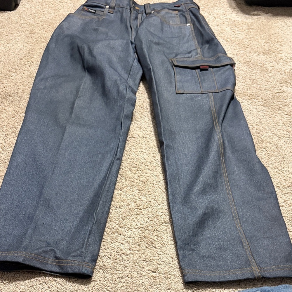 Vintage FUBU men's baggy wide-leg cargo denim jeans. Size 32 x34